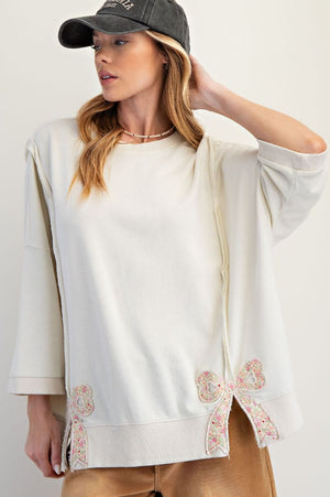 EASEL Women's Sweaters Bow Patch Bottom Hem Washed Terry Pullover || David's Clothing